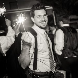 wedding photographer Matthew Foster holding sparkler