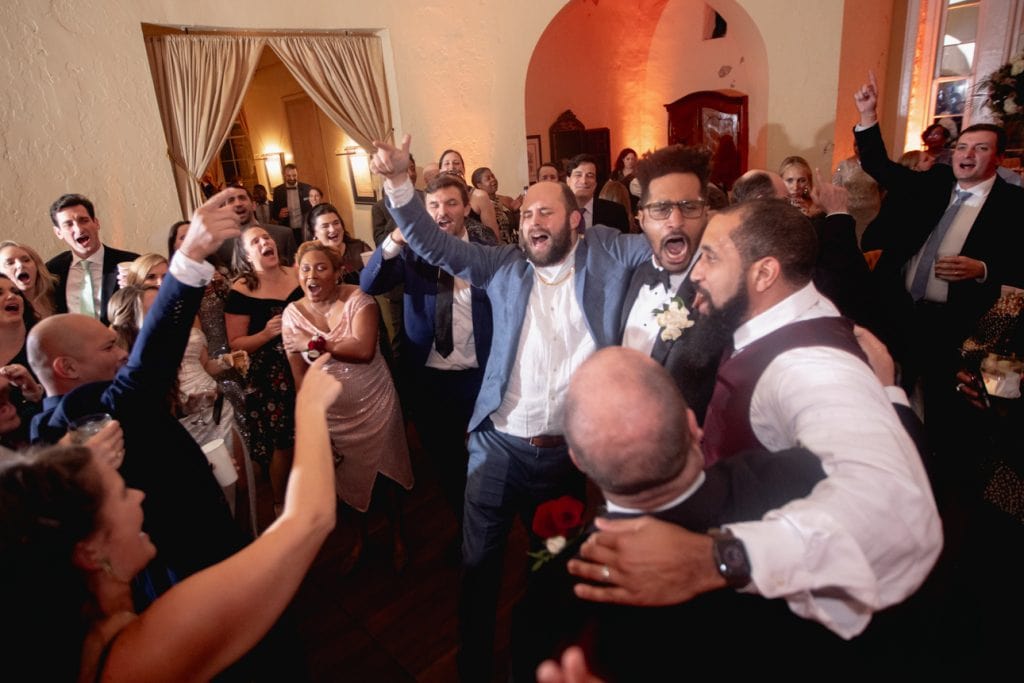 Guests enjoying a lively wedding celebration in New Orleans, captured by Matthew Foster Photography.