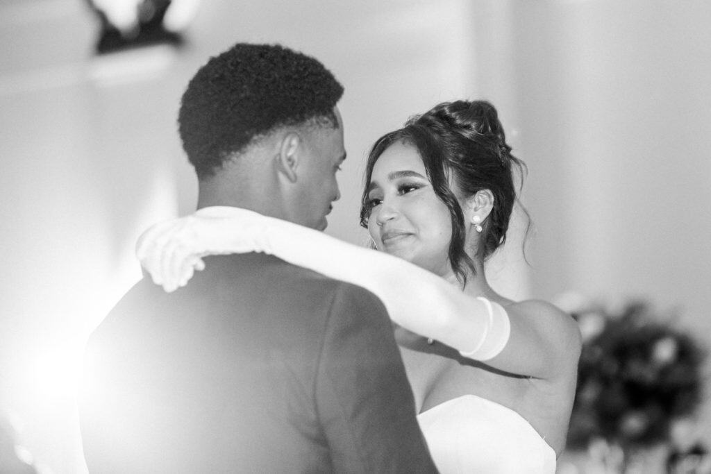 Close-up of bride and groom sharing a moment during wedding dance.