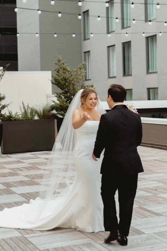 Bride and groom sharing a moment on their wedding day outdoors.