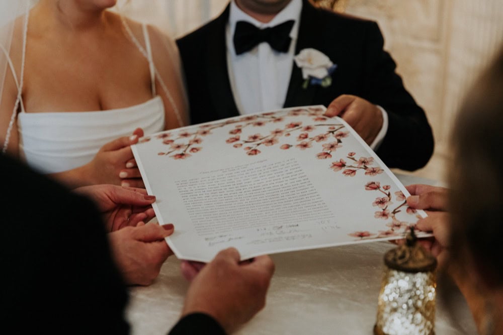 Wedding ceremony document signing in New Orleans with the bride and groom.