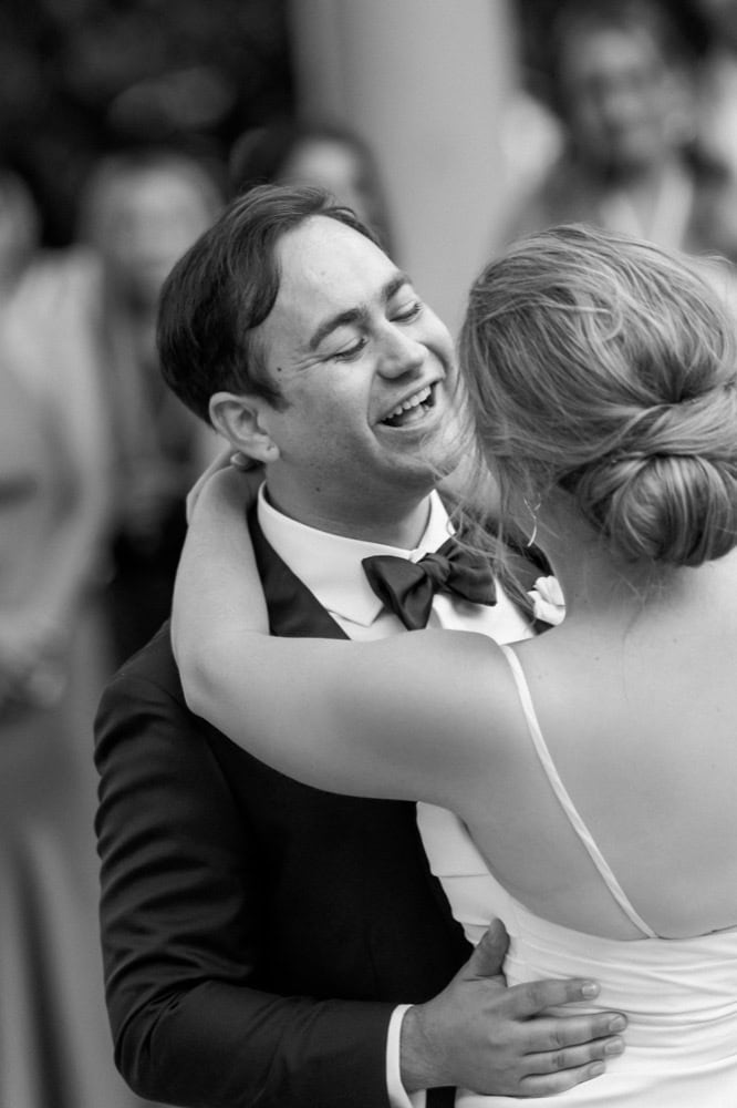 Elegant New Orleans wedding couple dancing happily at their celebration.