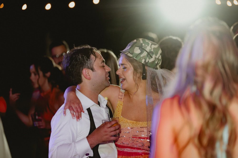 Wedding celebration in New Orleans with joyful couple dancing and celebrating.
