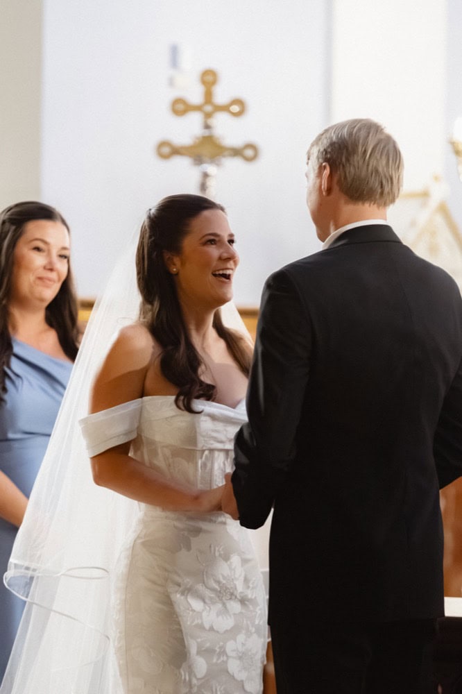 Bride and groom exchanging vows during a wedding ceremony in New Orleans.