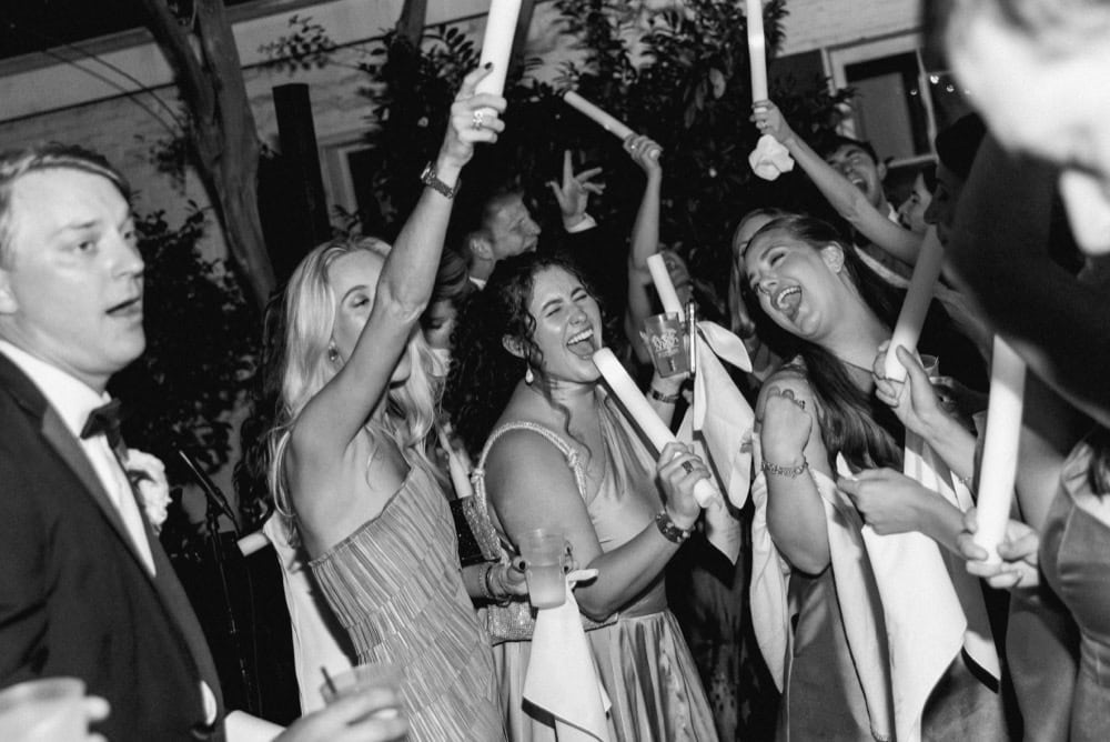 Celebrating joy at a New Orleans wedding with lively guests and festive atmosphere.