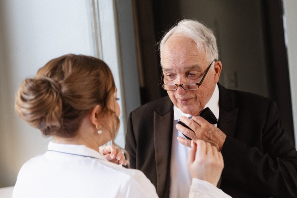 Father and daughter share a heartfelt moment before the wedding ceremony.