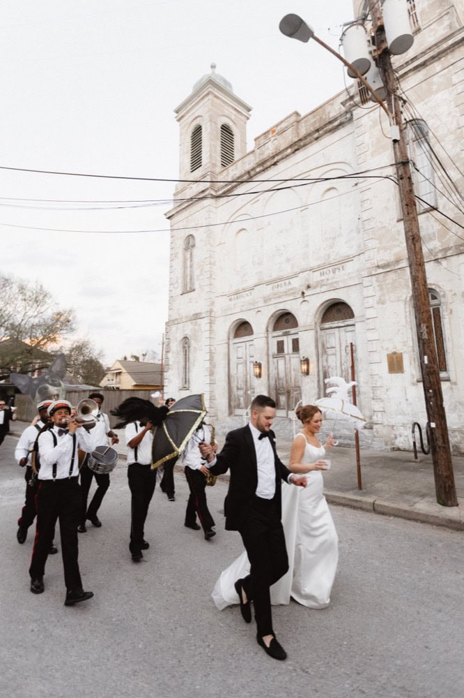 Wedding procession secondline parade outside the Marigny Opera House in New Orleans.