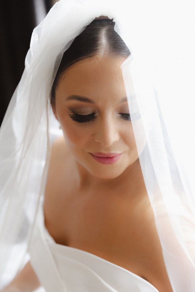 A bridal portrait of a bride looking pensive on her wedding day in New Orleans.