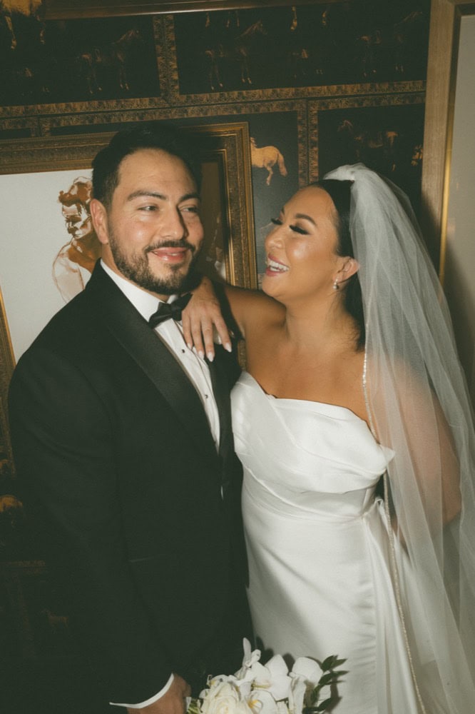 A bride and groom share a happy moment on their wedding day in New Orleans.