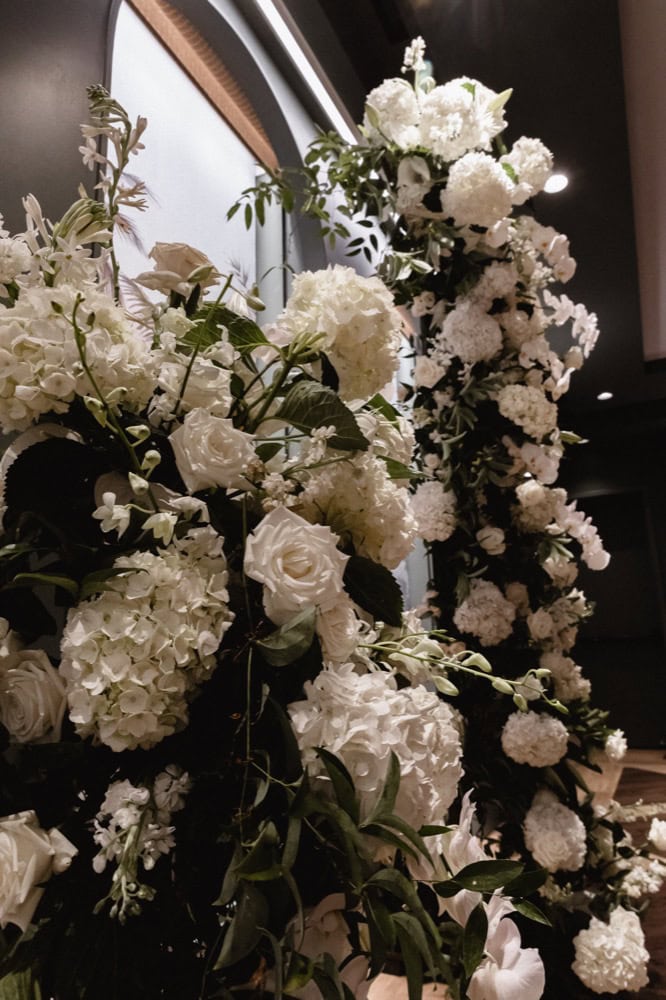 White florals on an altar at a wedding at the Virgin Hotel in New Orleans.