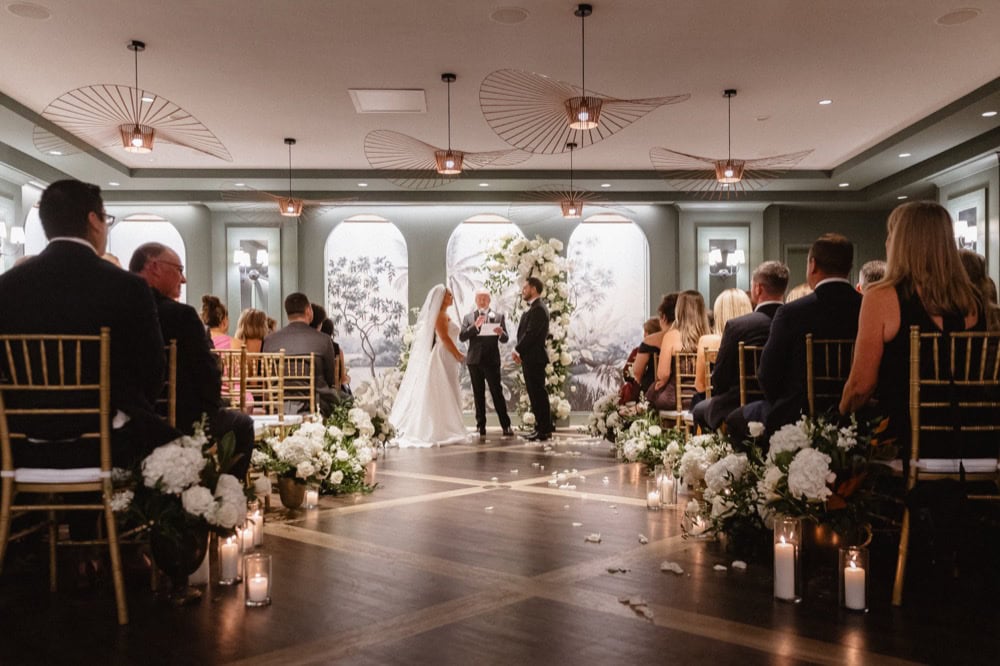 Bride and groom exchange vows at their wedding at the Virgin Hotel in New Orleans.