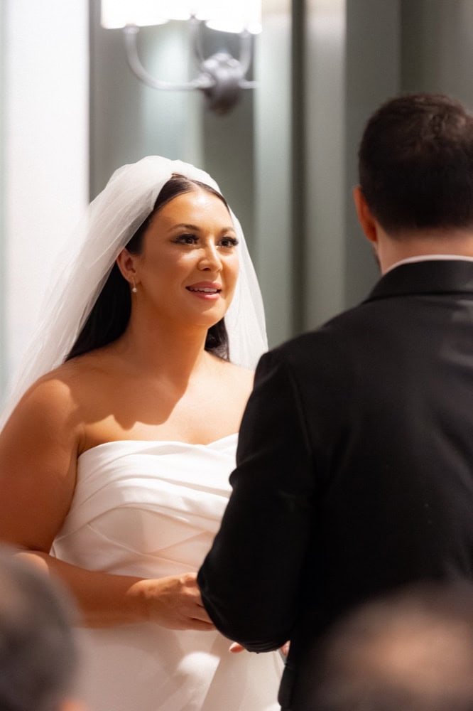 Bride and groom exchange vows at their wedding at the Virgin Hotel in New Orleans.
