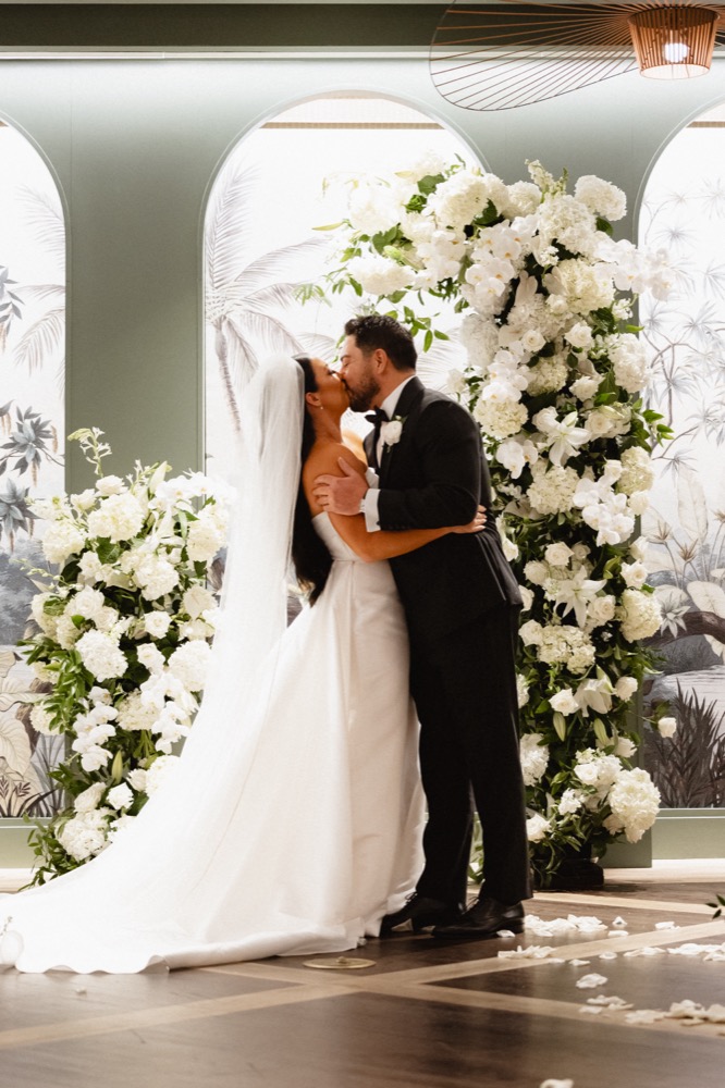 Bride and groom kiss at their wedding at the Virgin Hotel in New Orleans.