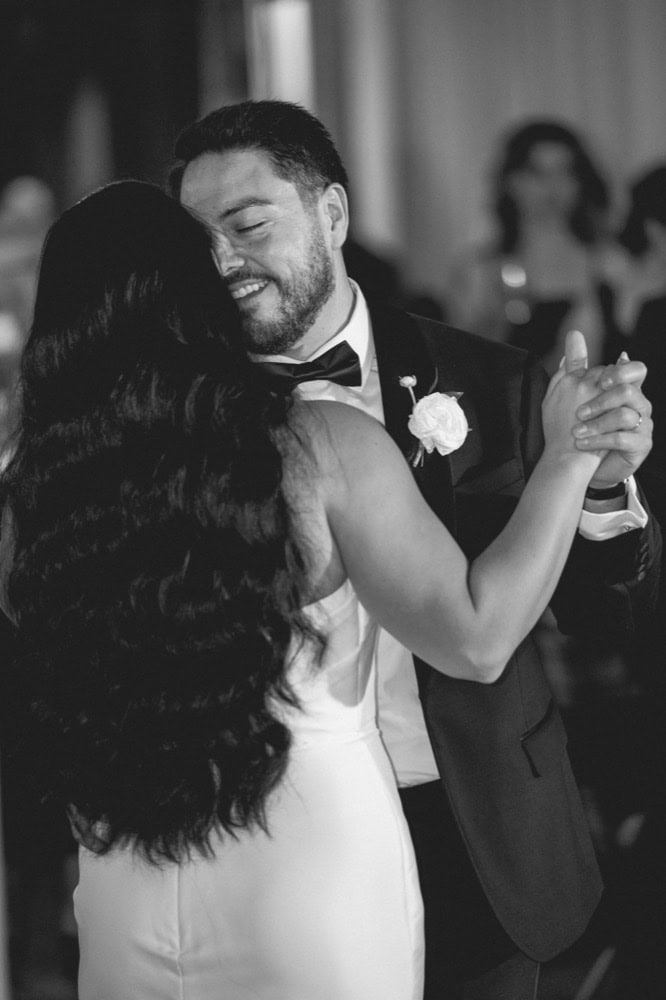 A bride and groom share a special moment during their first dance at their wedding reception at the Virgin Hotel in New Orleans.