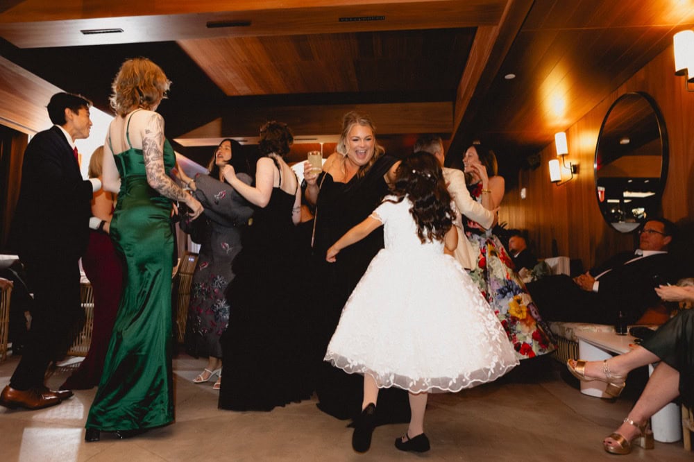 Guests dance at a wedding reception at the Virgin Hotel in New Orleans.