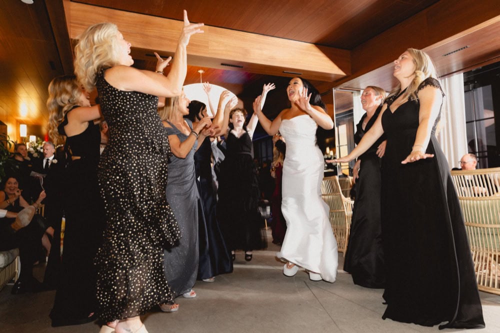 The bride and guests dance at a wedding reception at the Virgin Hotel in New Orleans.