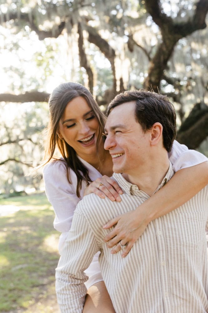 Happy couple outdoors during engagement photoshoot in New Orleans.