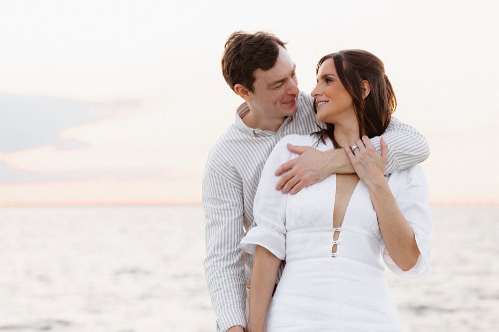 Romantic couple at sunset by the lakefront, wedding photography in New Orleans.