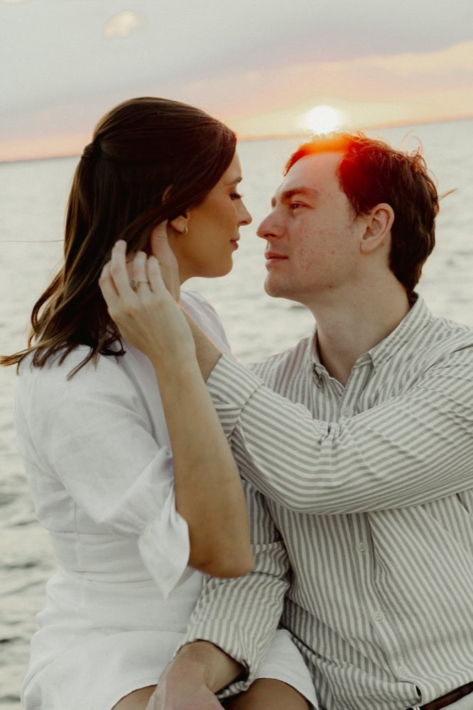Romantic couple at sunset on the lake, New Orleans wedding photography.