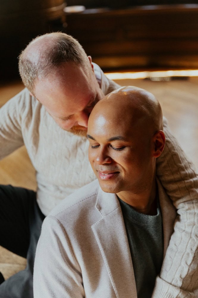 Couple sharing a tender, intimate moment indoors, capturing love and connection beautifully.