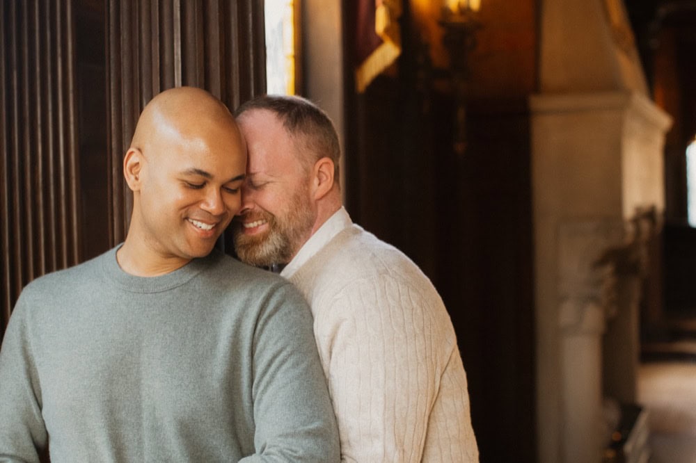 Happy couple embracing during their engagement at the Elms Mansion in New Orleans by Matthew Foster.