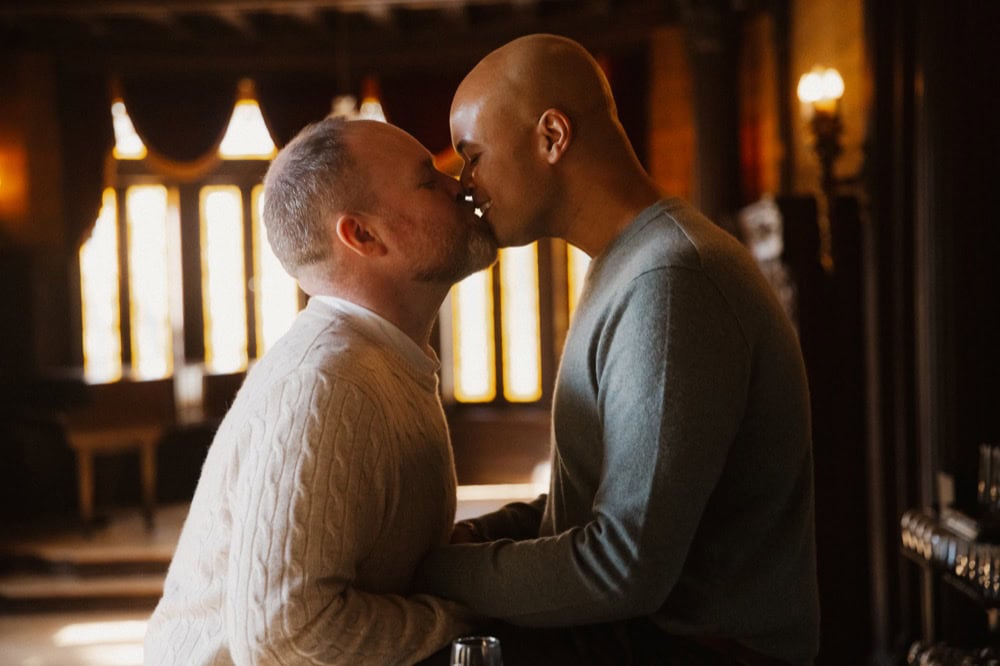 Intimate moment between two men at their engagement at the Elms Mansion in New Orleans.