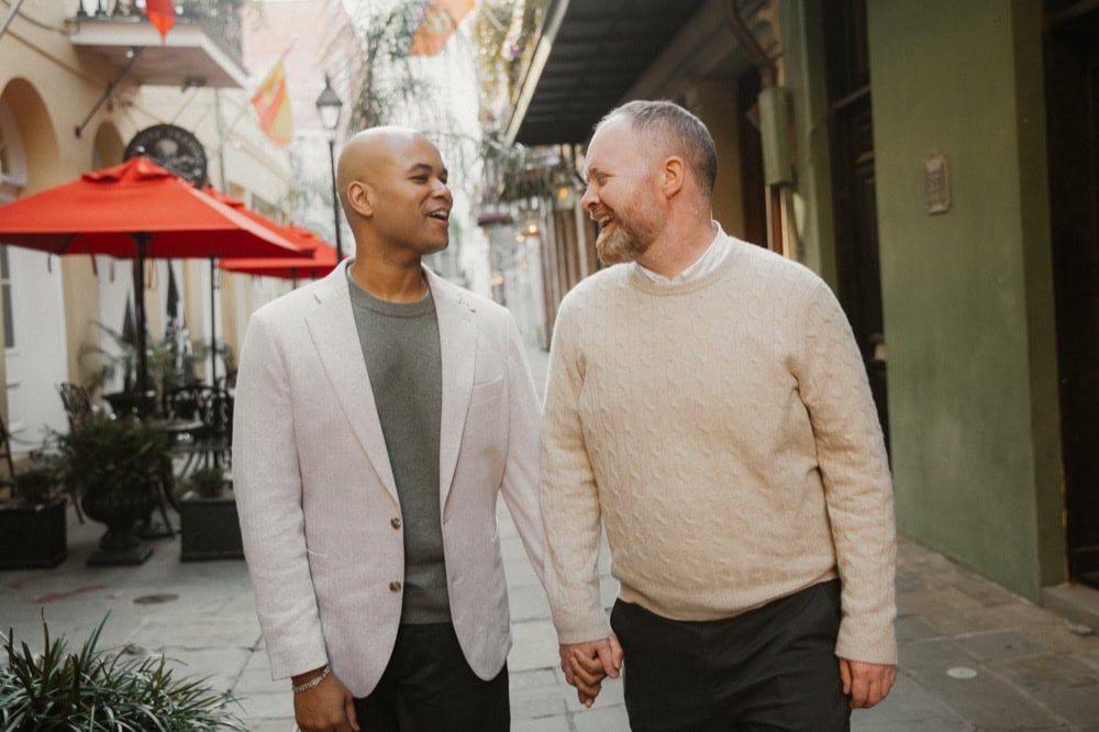 Couple walking hand in hand in New Orleans, capturing love and connection.