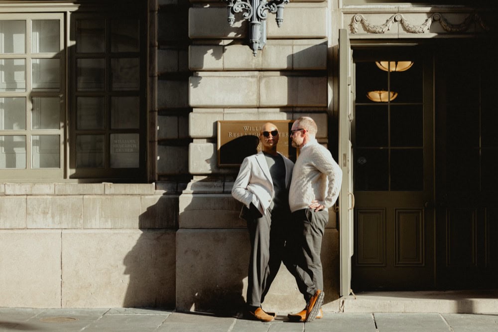 Stylish couple outside historic New Orleans building by Matthew Foster.