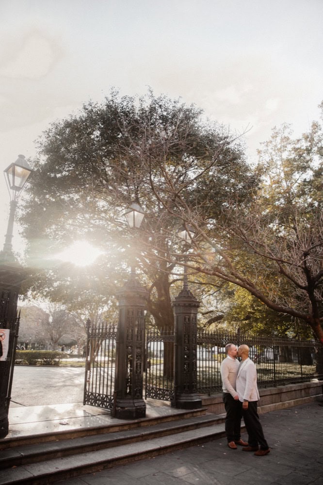 Couple under a large tree in Jackson Square in New Orleans.