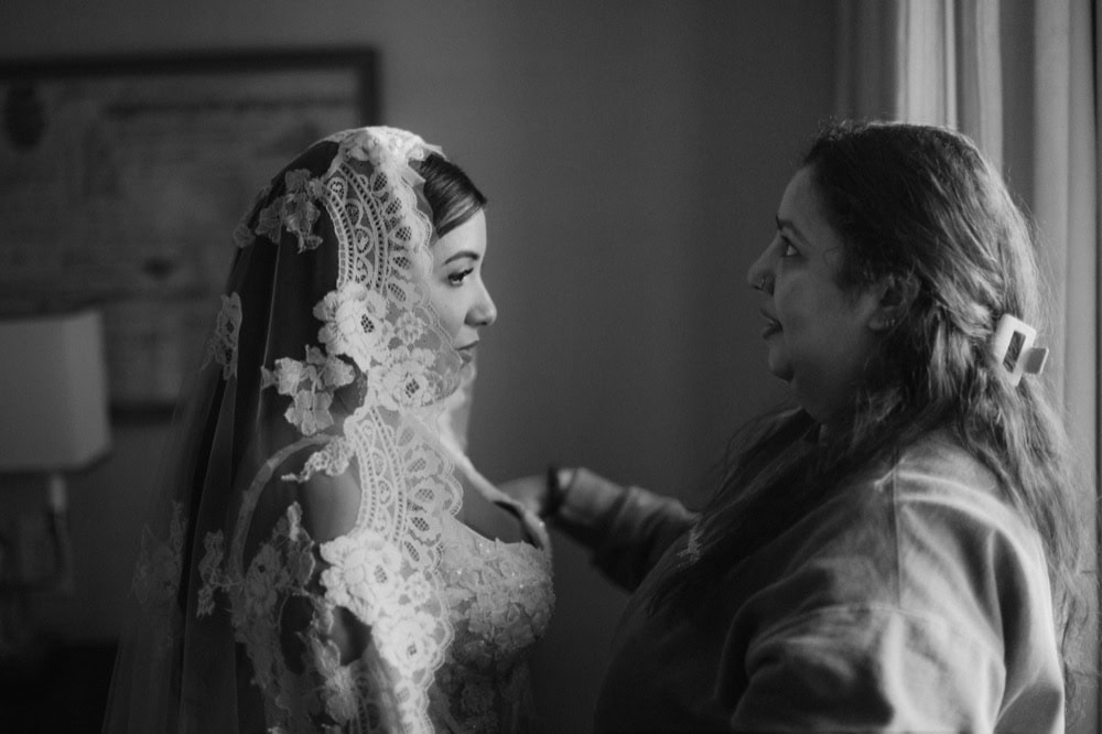 Bride and woman sharing a heartfelt moment before wedding in New Orleans.