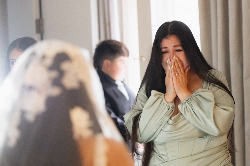 Wedding emotional moment in New Orleans, bride reacts happily.
