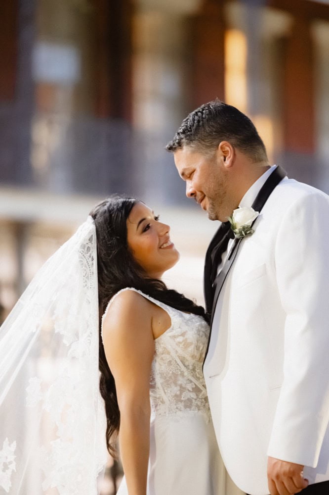 Elegant New Orleans wedding photo of bride and groom gazing at each other.