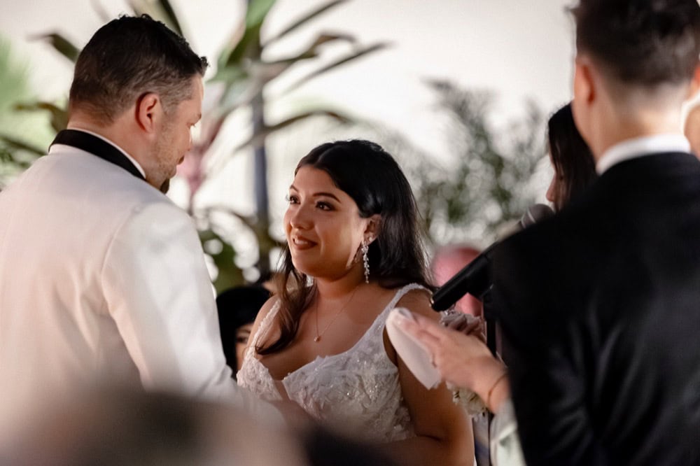 Bride and groom exchanging vows during a wedding ceremony in New Orleans.