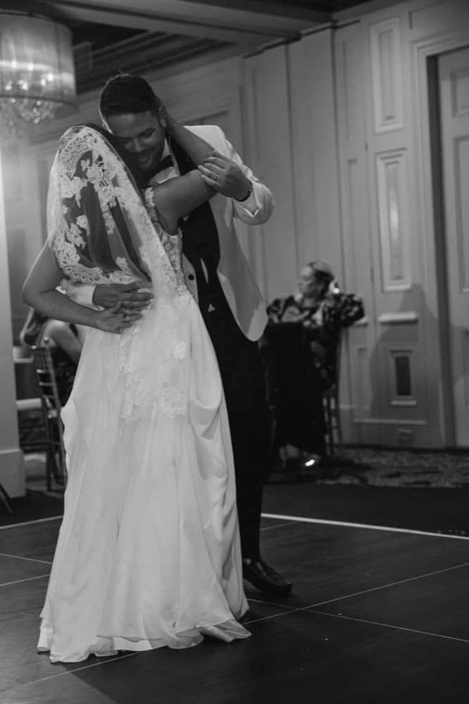 Bride and groom sharing a romantic dance at their wedding reception in New Orleans.