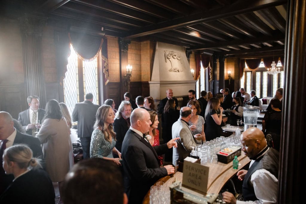 Guests enjoying a wedding reception at a historic New Orleans venue.
