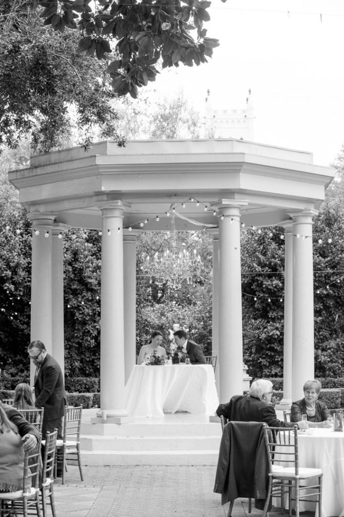 Elegant outdoor wedding ceremony at a classical pavilion in New Orleans.