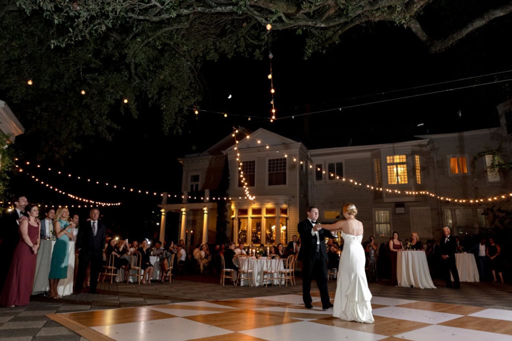 Bride and groom dancing at outdoor wedding reception in New Orleans.