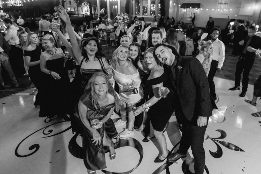 Group of wedding guests dancing and celebrating at a New Orleans wedding.