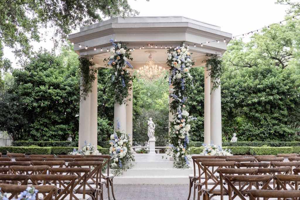 Beautiful outdoor wedding altar with floral decorations in New Orleans.
