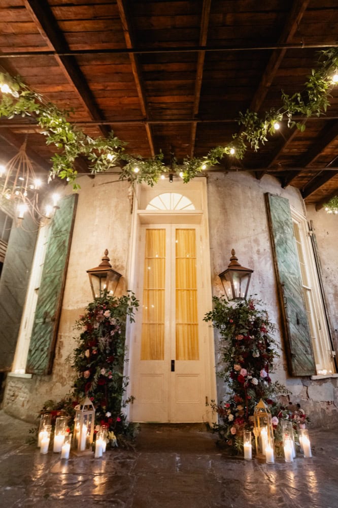 Elegant wedding decor with floral arrangements and candles in New Orleans.