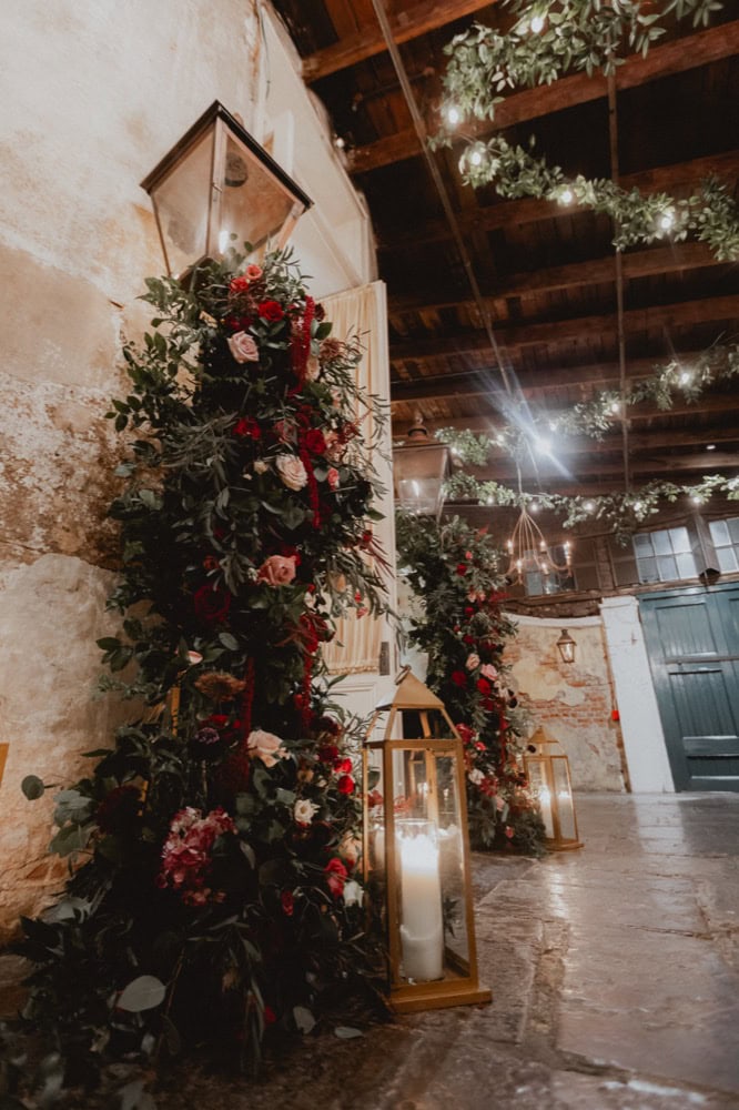 Elegant wedding floral arrangement with candles in lanterns in New Orleans.