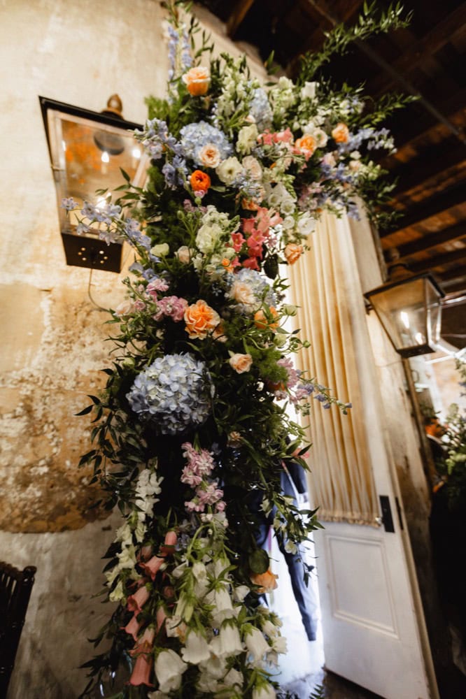 Elegant wedding floral arrangement with roses, hydrangeas, and greenery in New Orleans.