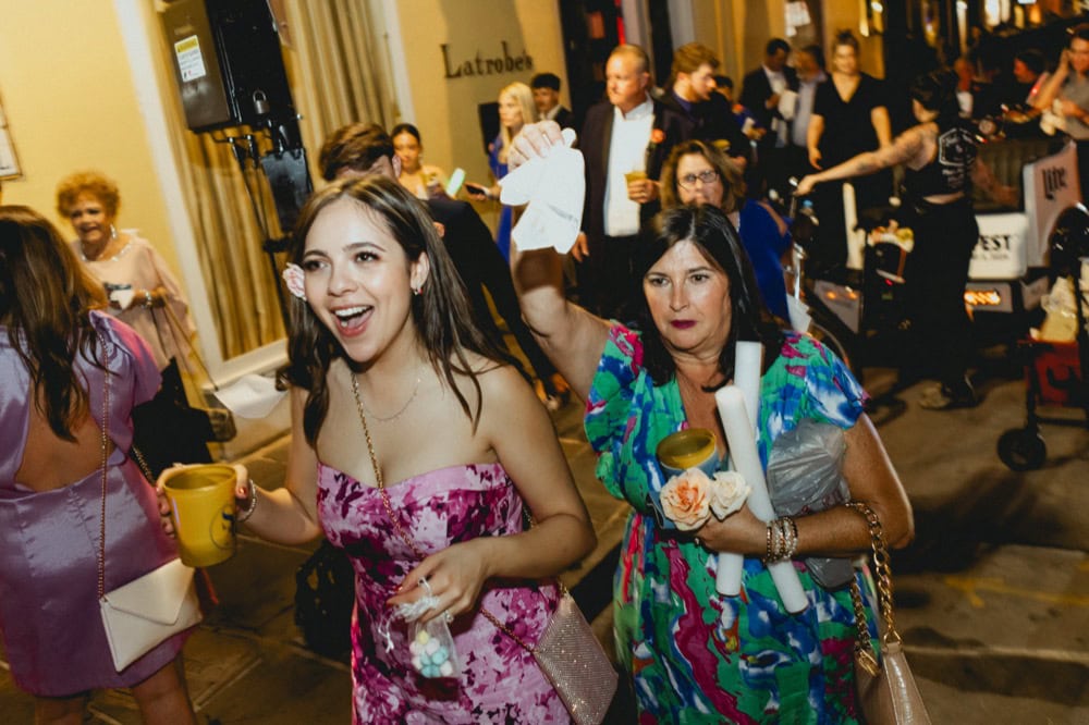 Wedding celebration in New Orleans with joyful guests and vibrant atmosphere.