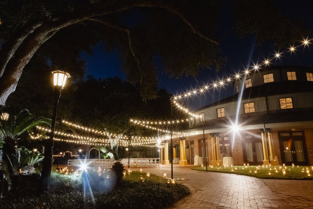 Beautiful outdoor wedding venue in New Orleans with string lights and elegant architecture.