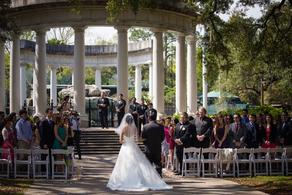 Beautiful outdoor wedding ceremony in New Orleans with bride and groom at the Audubon Zoo.