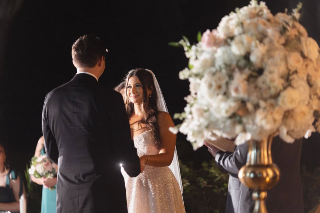 Bride and groom exchanging vows at a New Orleans wedding ceremony.