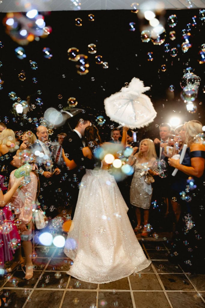 Wedding celebration with bubbles and guests in New Orleans.