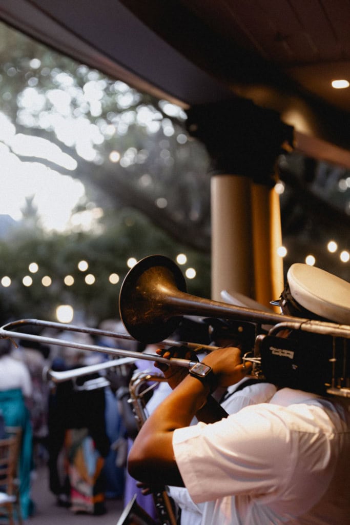 Musician playing trumpet at New Orleans wedding reception.
