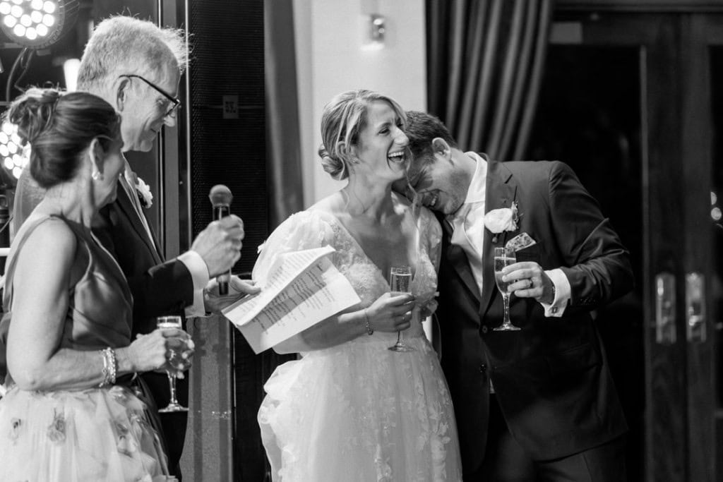 Bride and groom sharing a toast at their wedding reception in New Orleans.