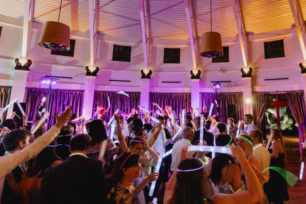 Wedding reception in New Orleans with dancing and vibrant lighting.